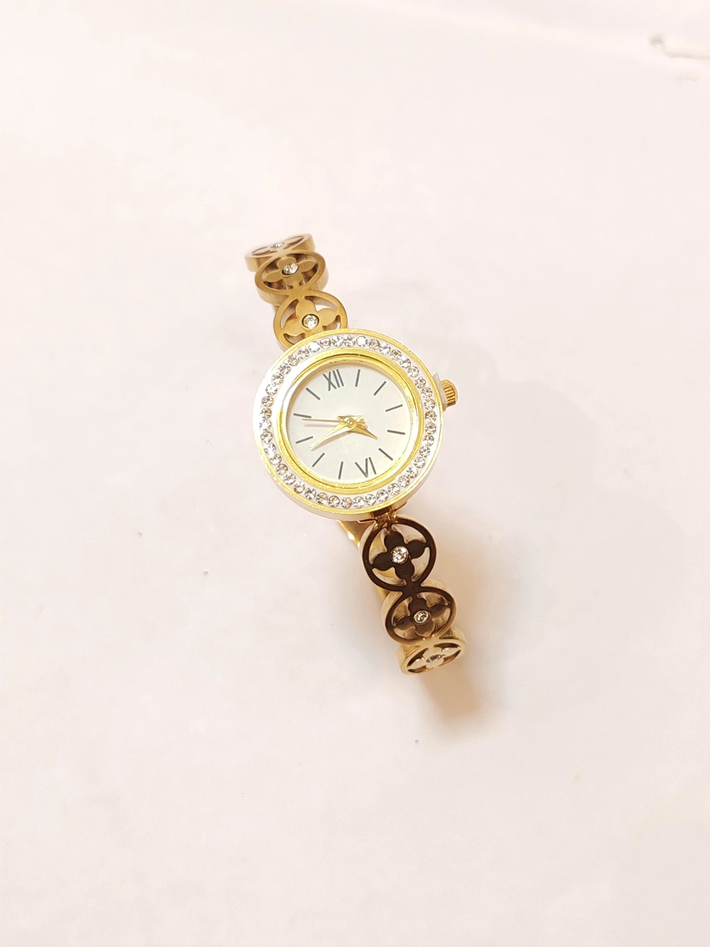 Elegance in Motion: Gold Clover Link Wristwatch