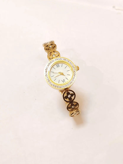 Elegance in Motion: Gold Clover Link Wristwatch