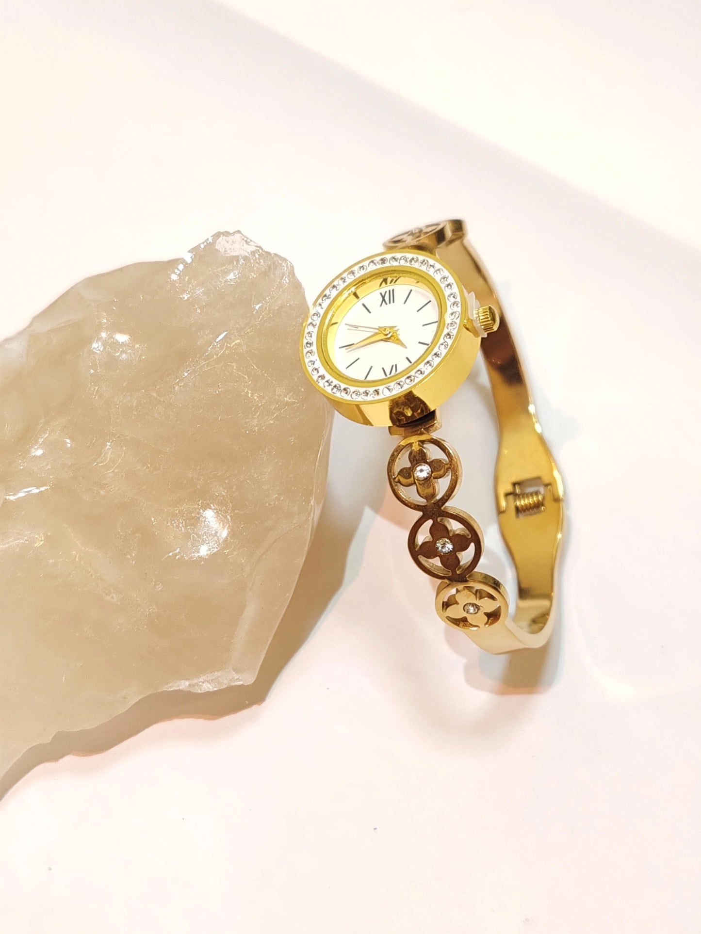 Elegance in Motion: Gold Clover Link Wristwatch